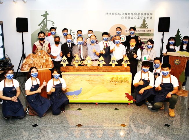 A group photo of the honored guests and project team at the “Wood Works” presentation and exhibition