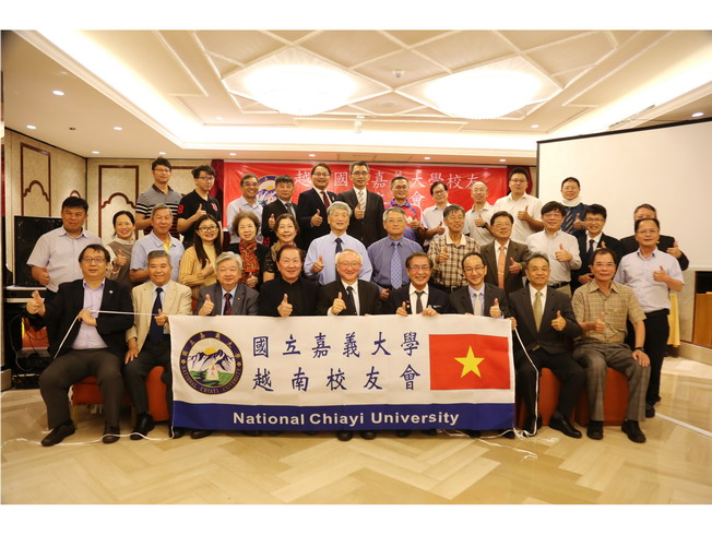 A group photo of attendees of the Vietnam Alumni Association Founding Conference, including Taiwanese alumni and staff led by NCYU President Chyung Ay 